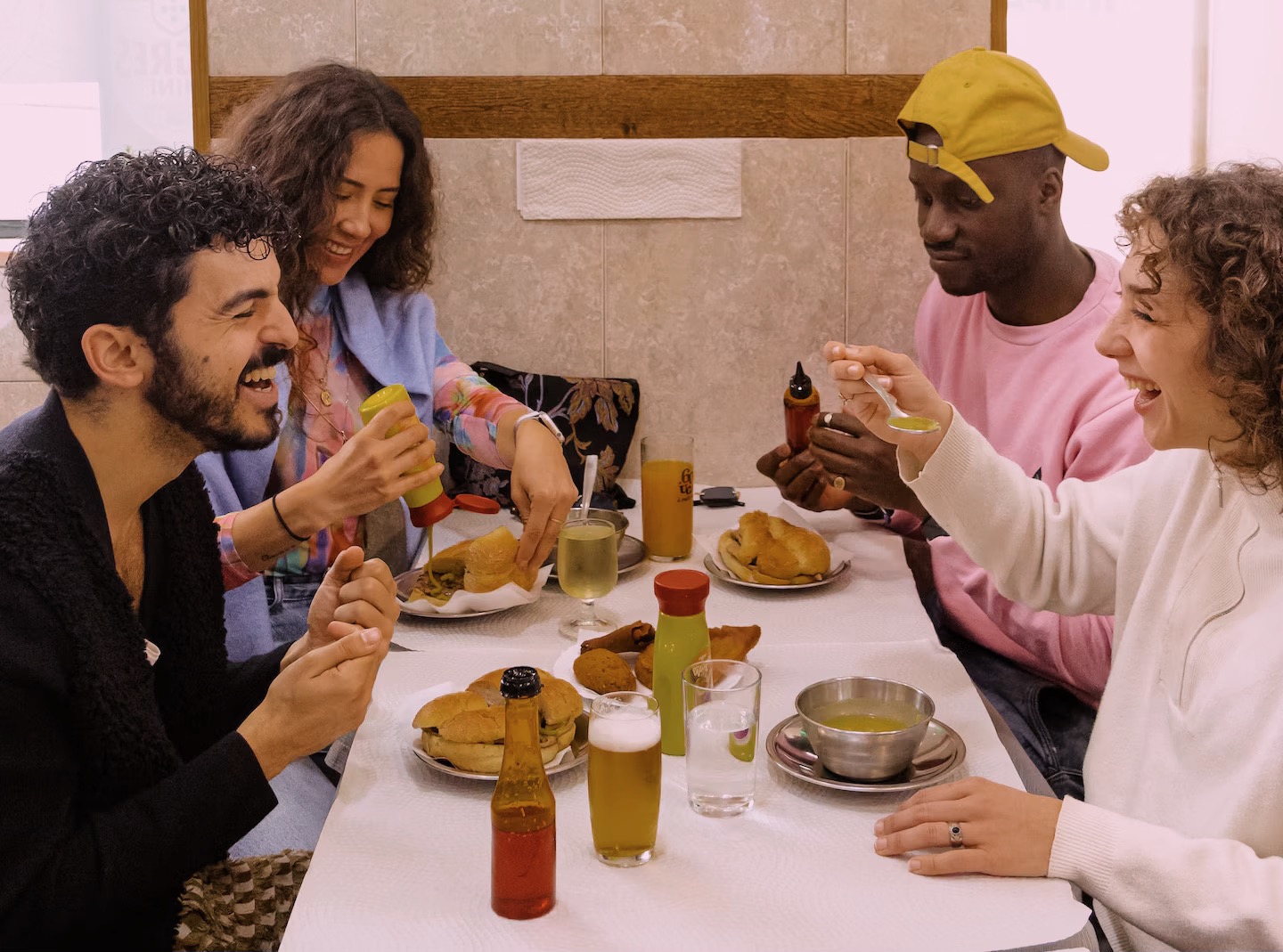 Tourists smiling and enjoying The Portuguese Food Tour in Lisbon with a local guide